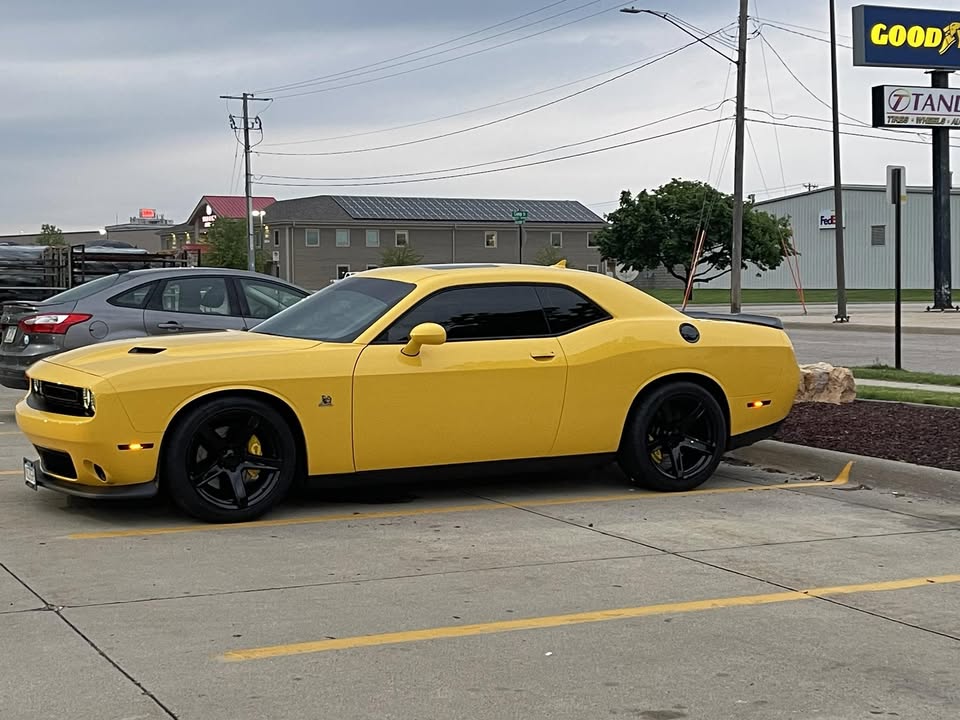 Yellow Dodge Challenger gleaming after a full detail by Detailz in Albert Lea