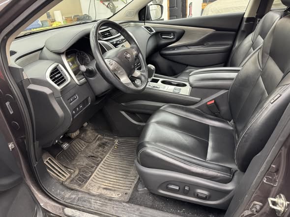 Spotless front seats, dash and console after interior detailing
